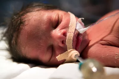 Newborn with feeding tubes