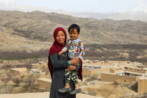 Tahira holds her 3-year-old son, Armin