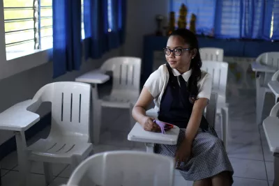 A girl sitting in a classroom