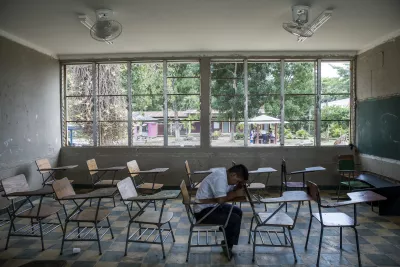 Violence in schools. A student sits in a classroom in Villanueva, Honduras