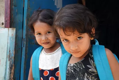 Bangladesh. Two refugee children stand outside a UNICEF learning centre.