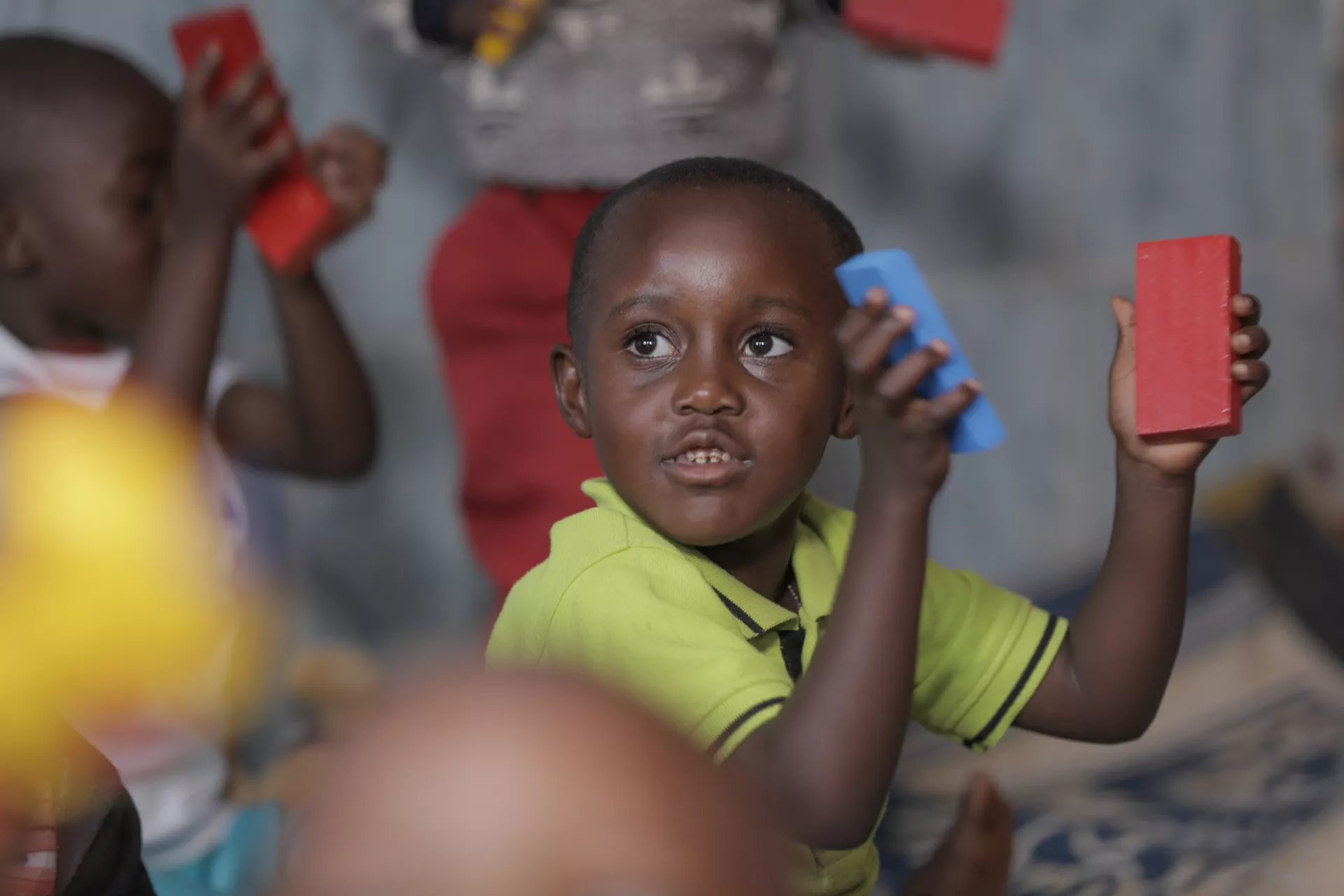 A young boy plays and learns with blocks in an early childhood development centre in Rwanda.