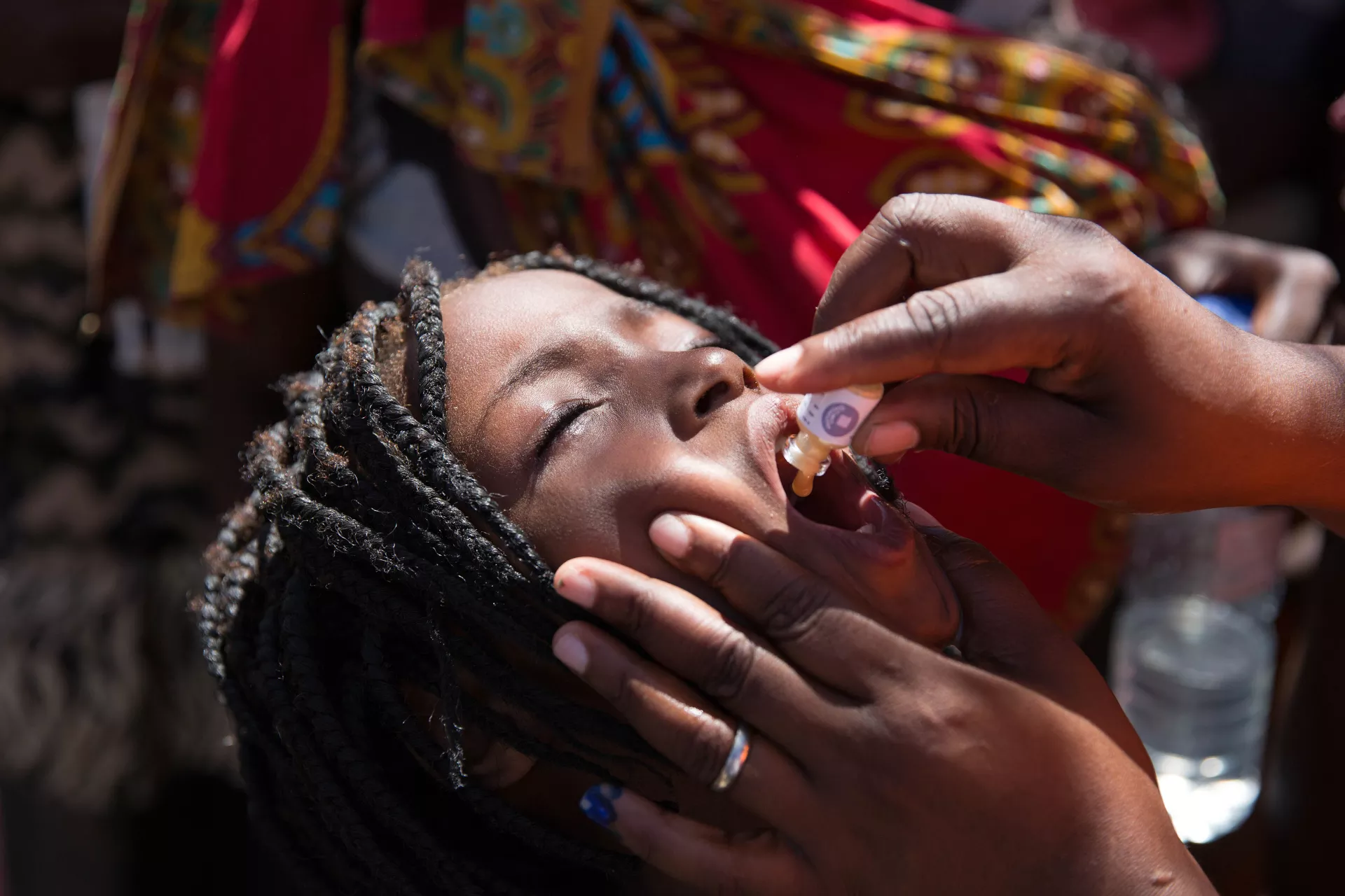 Mozambique. A child receives the vaccine for cholera at accommodation for people displaced by Cyclone Idai.