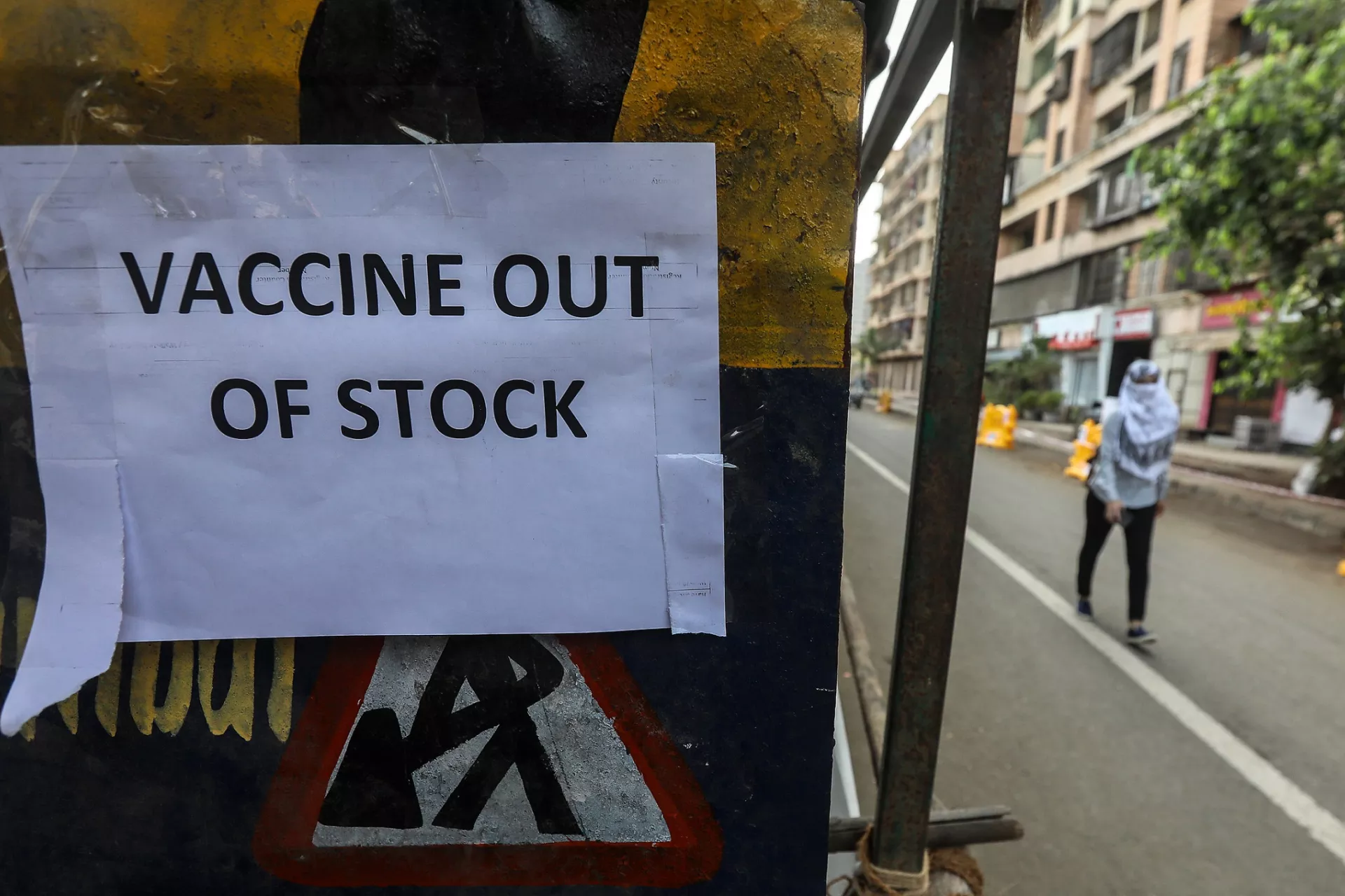 India. A notice is displayed with a message about the shortage of COVID-19 vaccines.