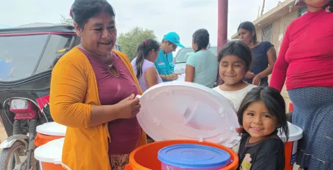 Families in Lambayeque, Peru look through WASH items