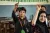 A boy raises his hand in a classroom, Pakistan