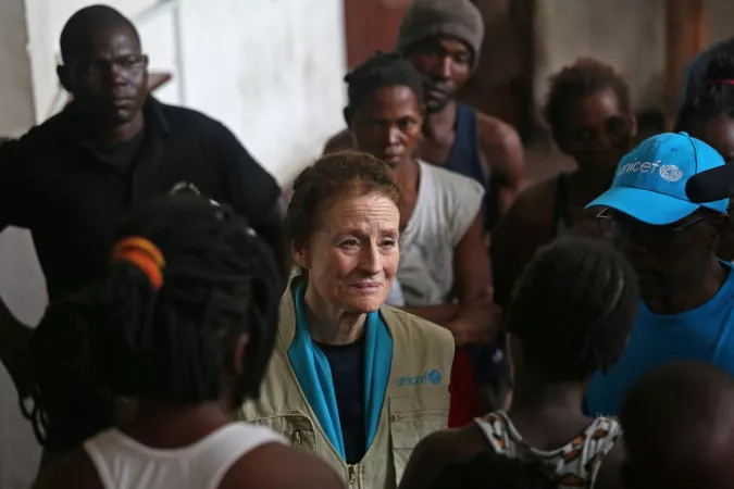On 22 March 2019 in Beira in Mozambique, (centre) UNICEF Executive Director Henrietta H. Fore speaks with internally displaced people as she visits a secondary school used to shelter evacuees from Cyclone Idai.