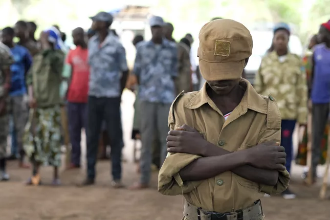 On 17 April 2018 in Yambio, South Sudan, Jackson*, 13, stands during a ceremony to release children from the ranks of armed groups and start a process of reintegration. 